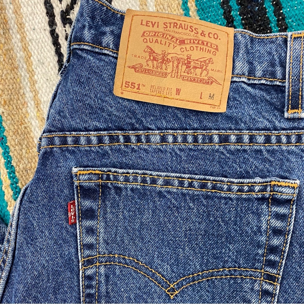 Vintage 90s Levi’s 551 red tab relaxed fit tapered leg jeans. Made in USA